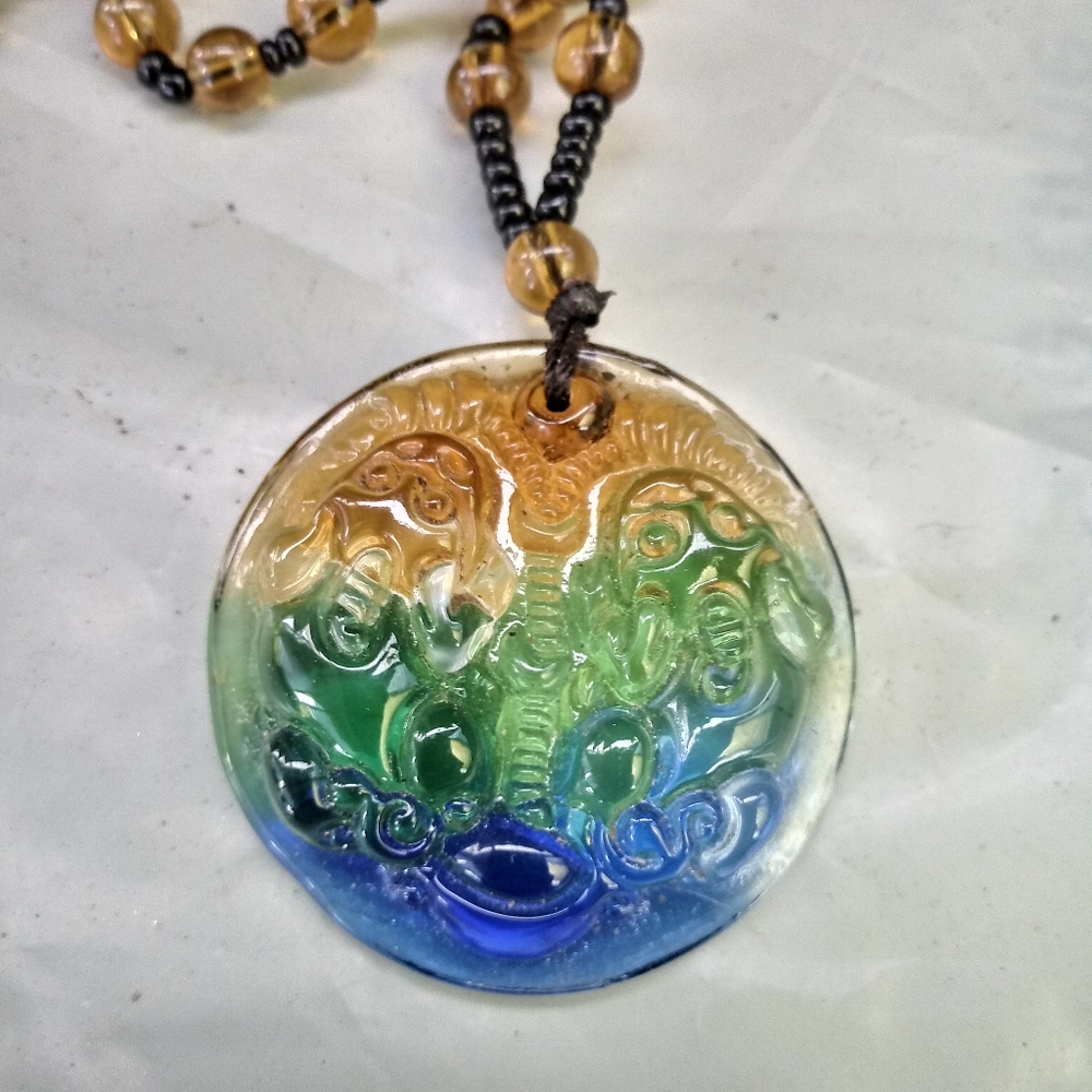 Glass oriental gemini necklace